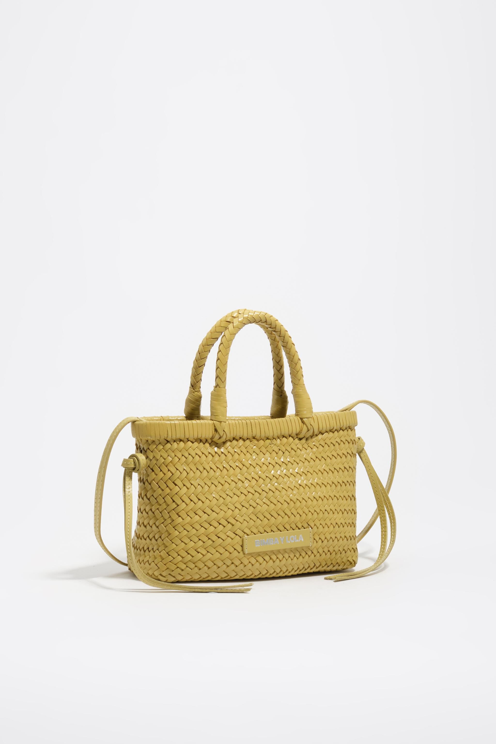 Liten knutad ljusgul läderbagage
