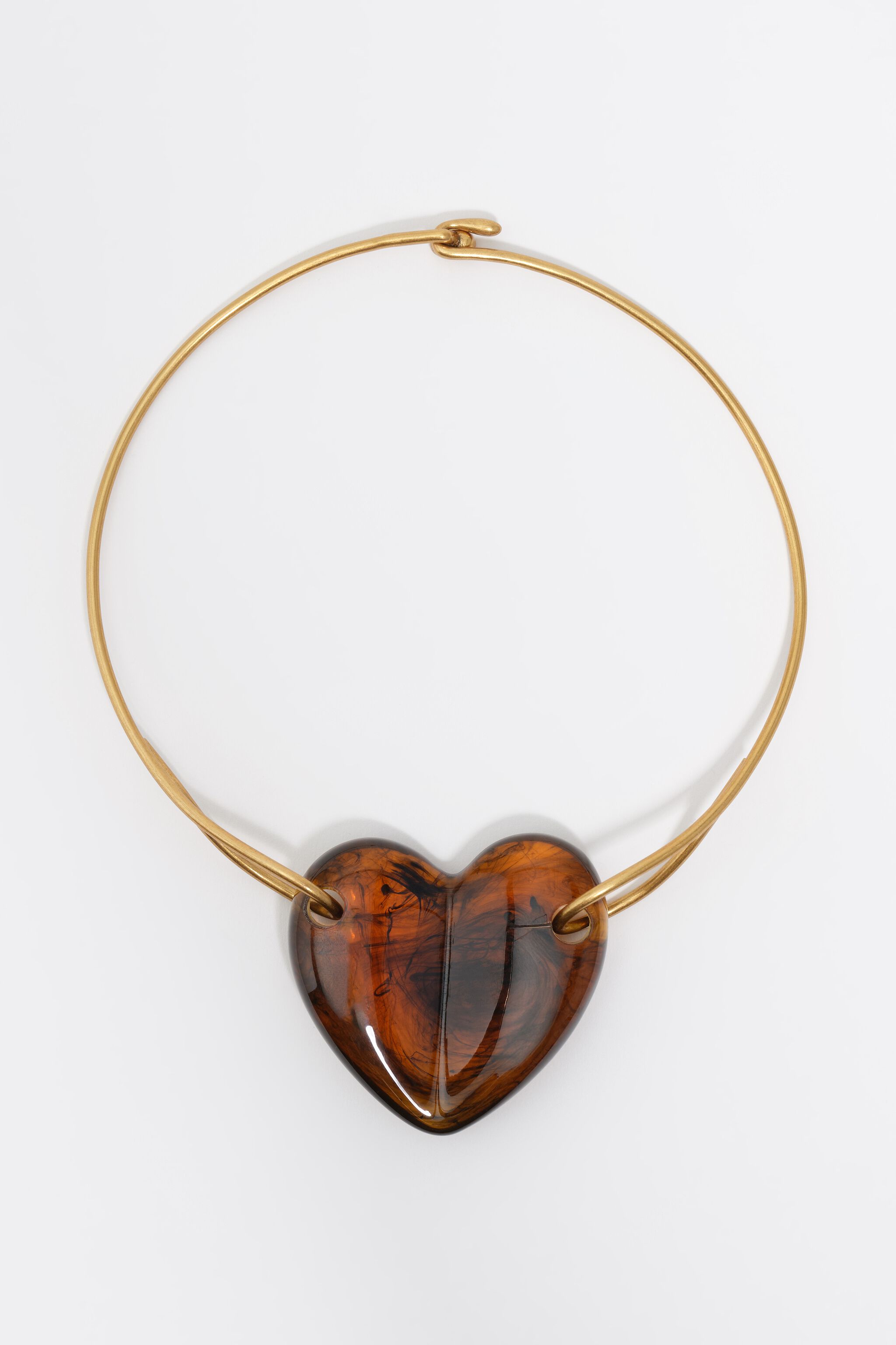 Hjärtformad halsklocka i amberresin