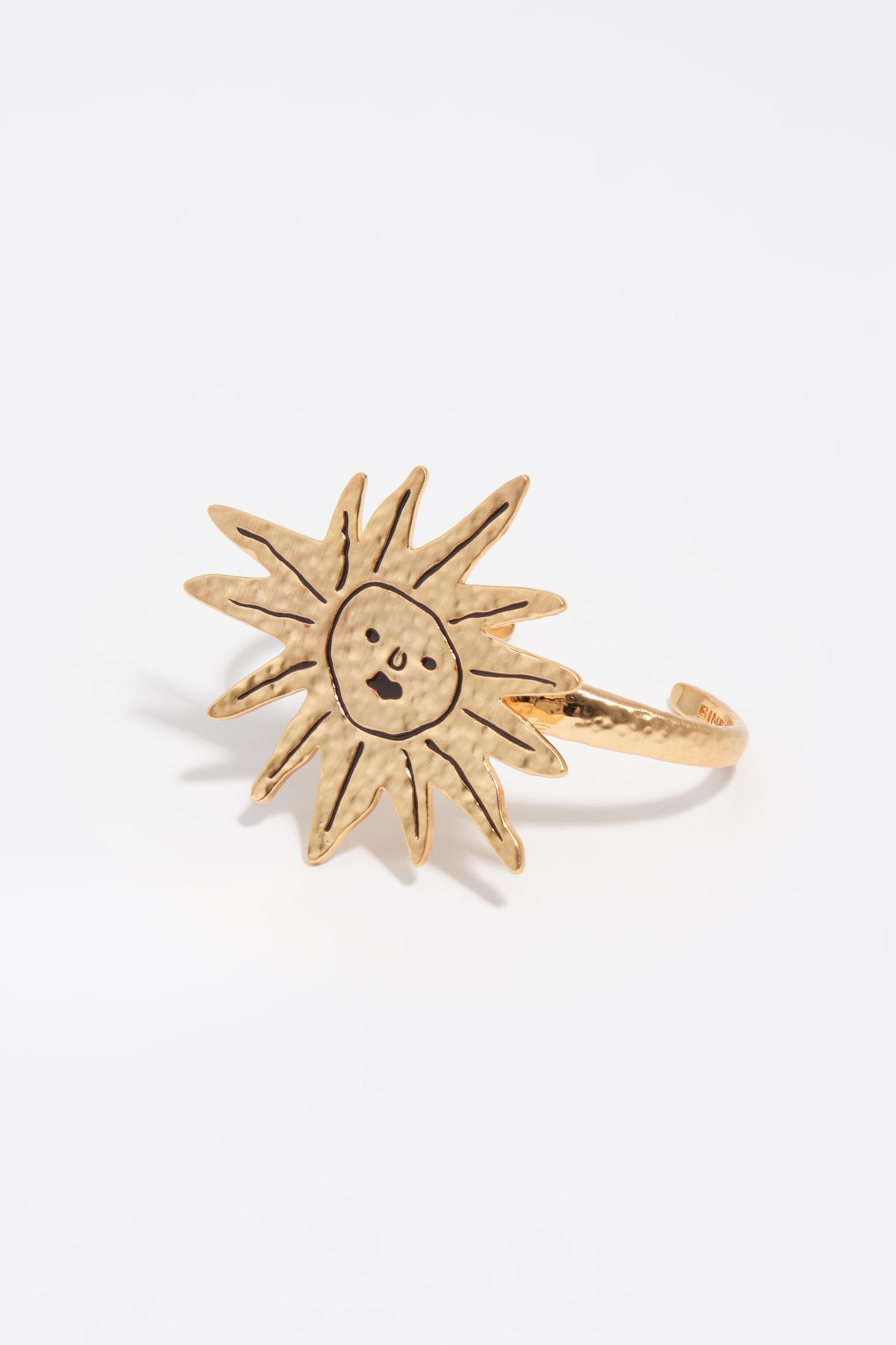 Solarmband med borstade guldtextur
