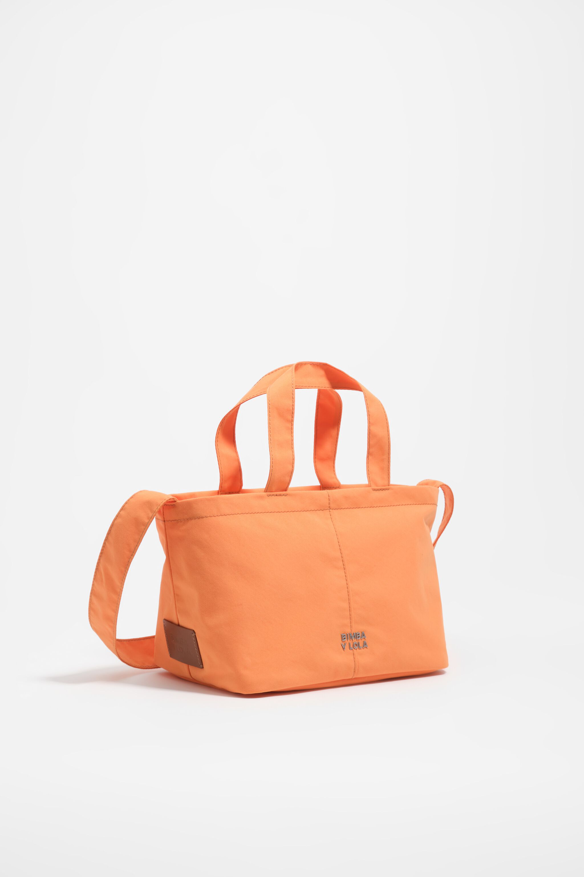 Orange nylon väska över axeln