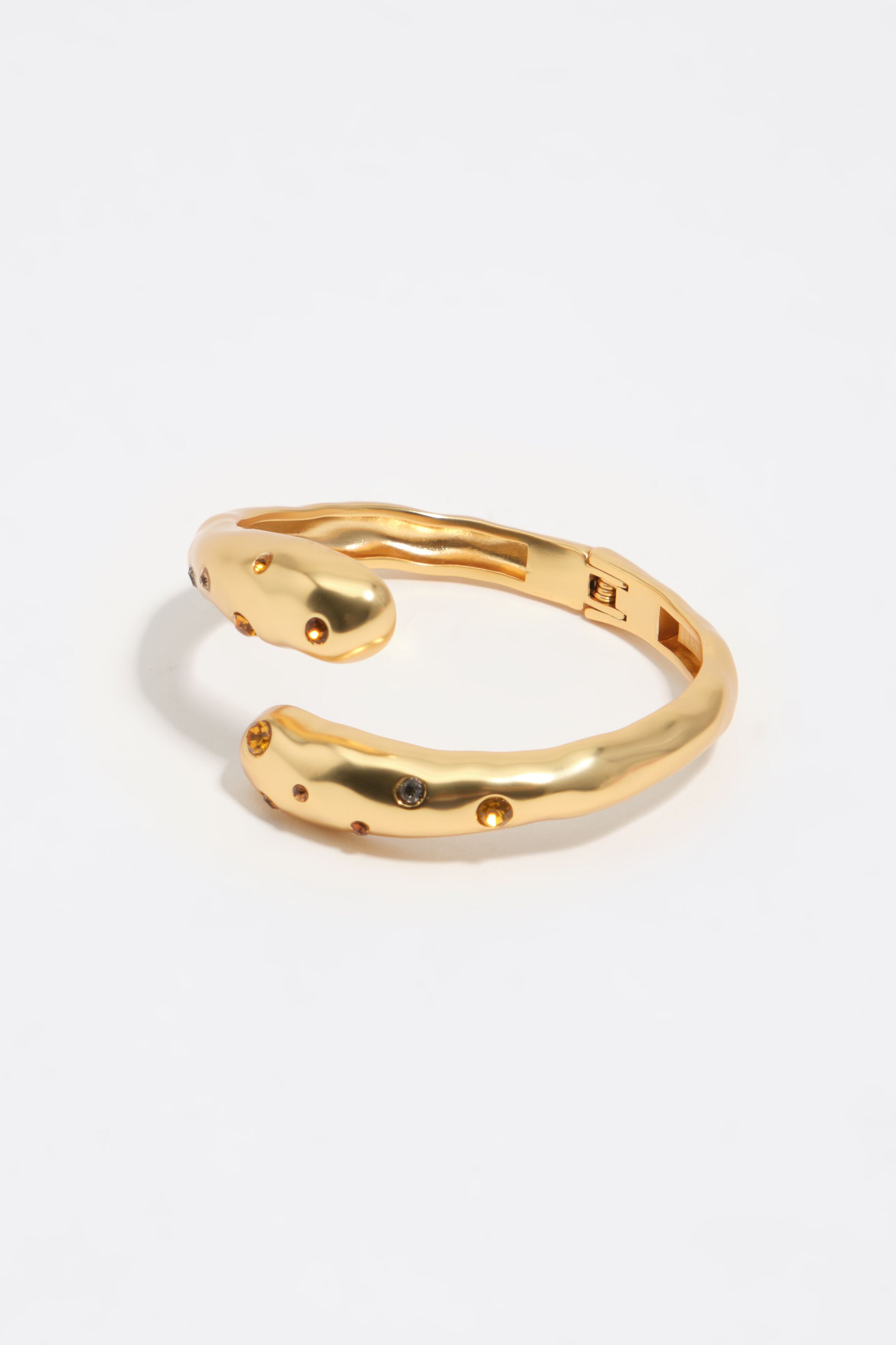 Matt guld texturerad korsande och kristallarmband Matt guld texturerad korsande och kristallarmband