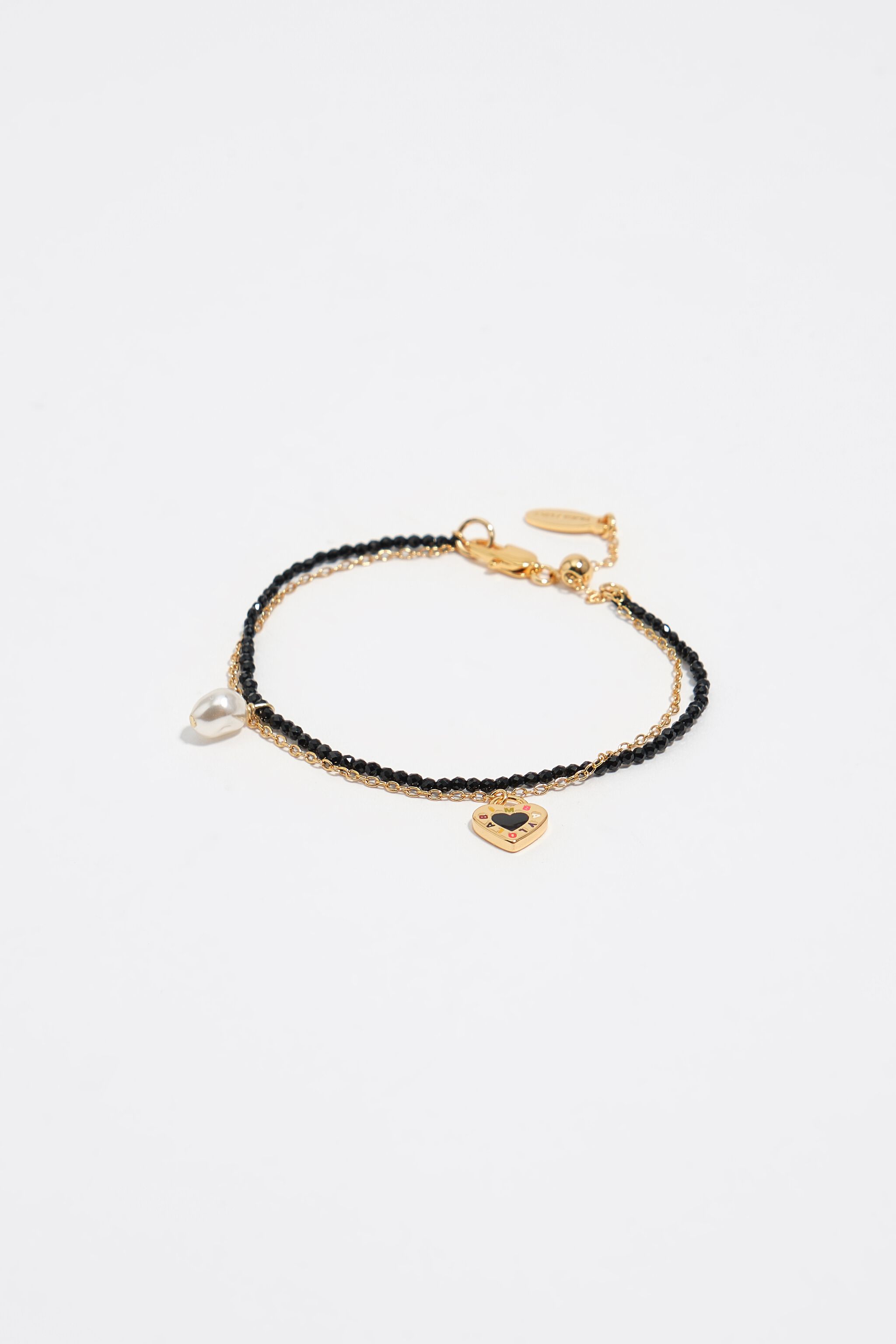 Svart dubbelarmband med kristaller och hjärta-logotyp